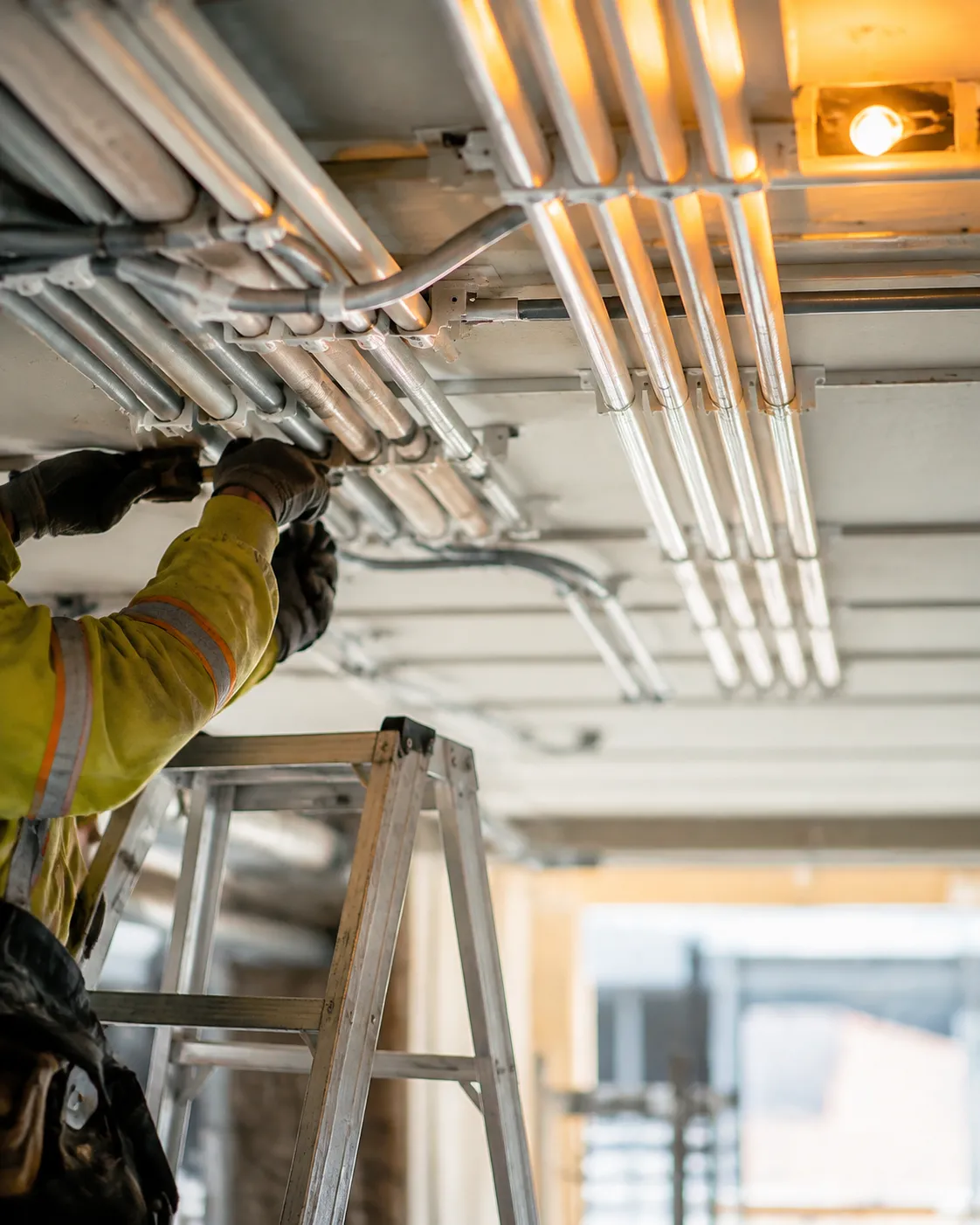 Parallel electrical conduit runs across a commercial ceiling